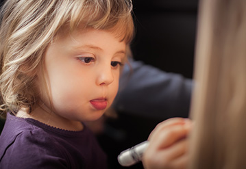 Syndrome child writing in a table developing cognitives abbilities